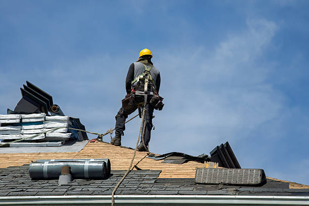 Professional Roof Replacement technician working in Laredo, MO